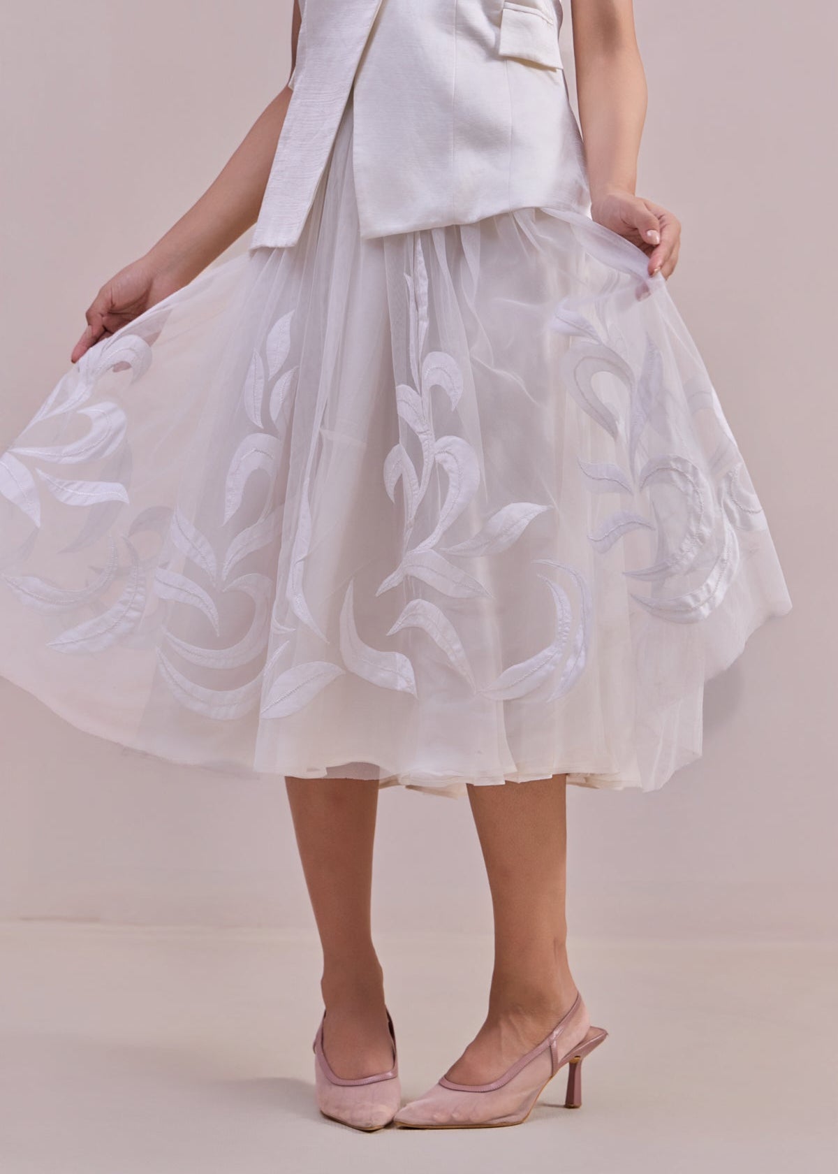 White floral dress with a plain background